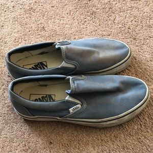 Baby blue slip-on Vans.